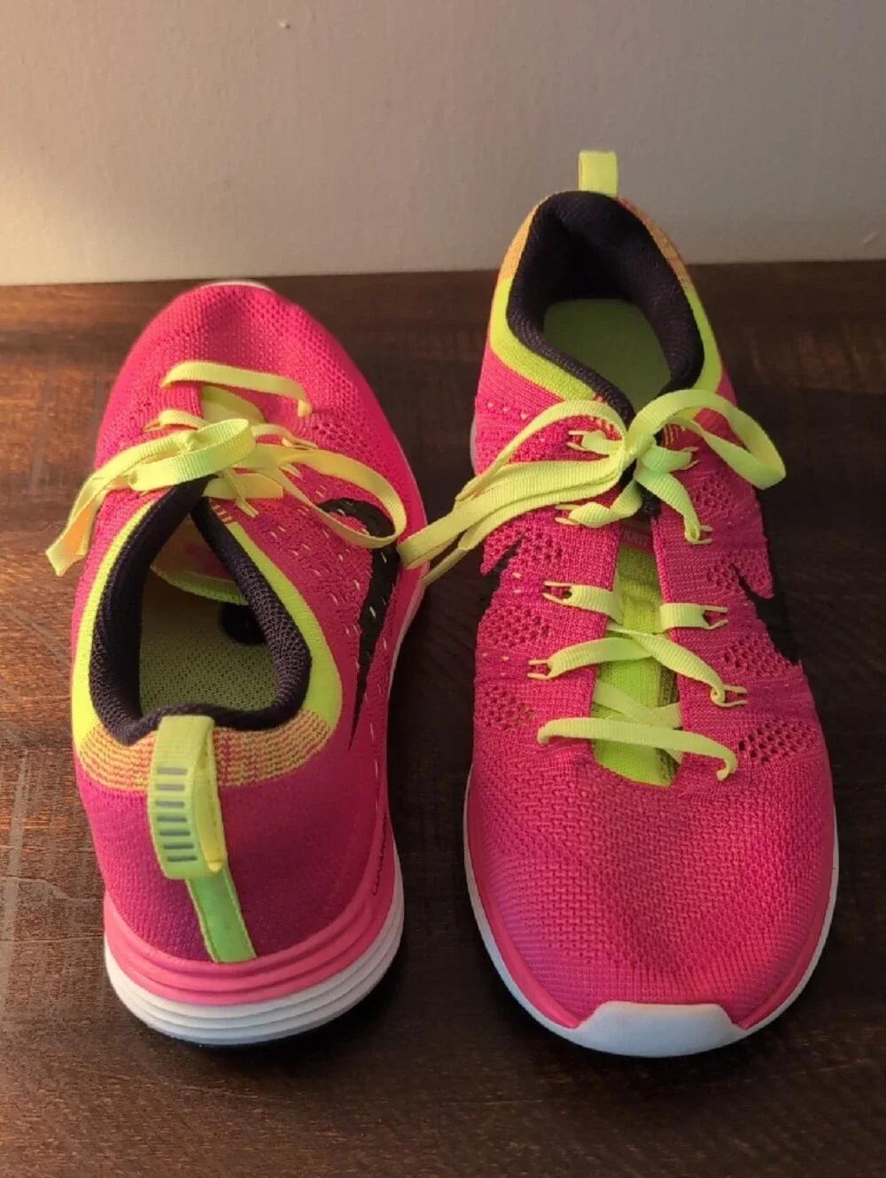 Nike Women’s Pink and Neon Yellow Flyknit Running Shoes
